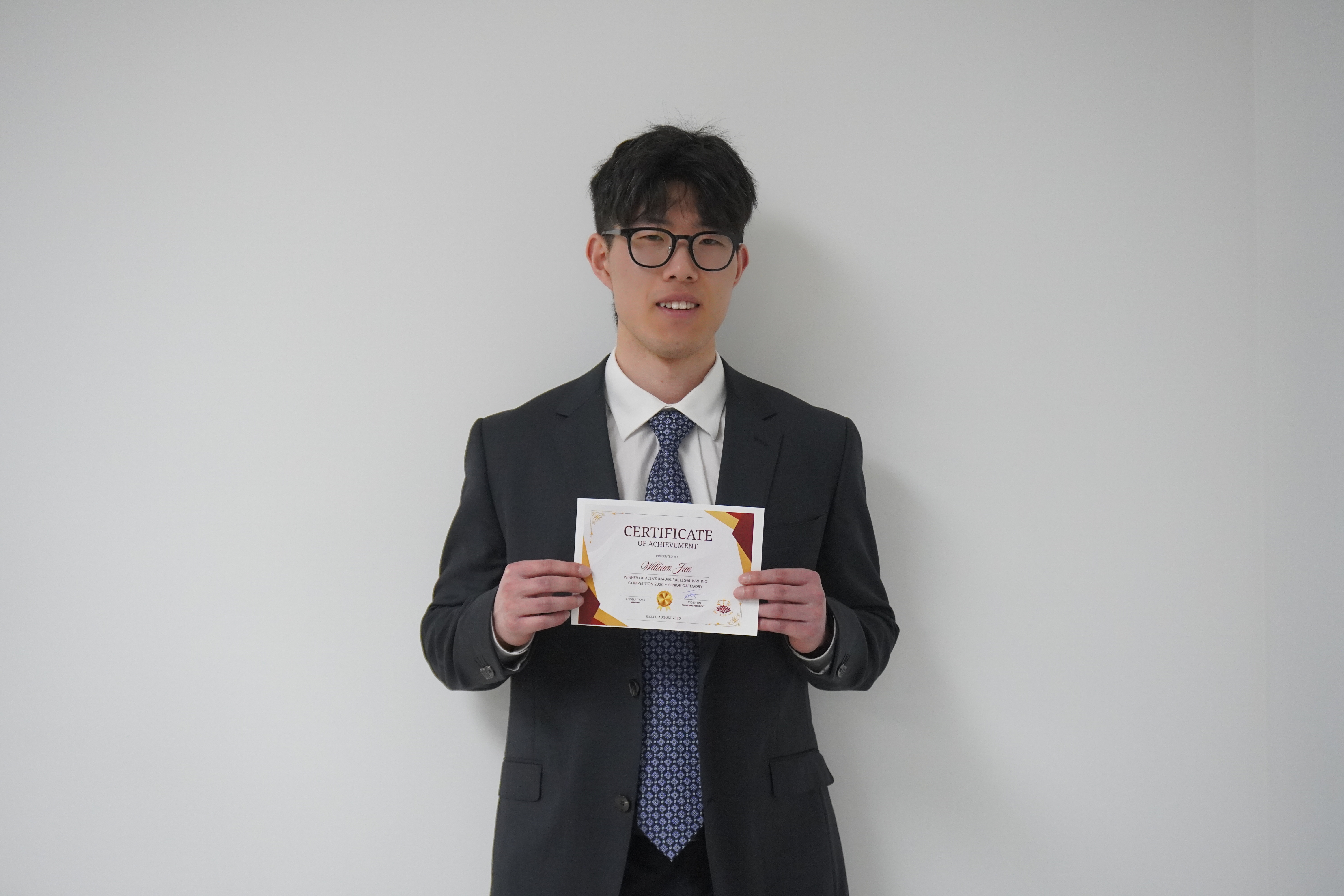 William Jun, Senior category winner, with his certificate