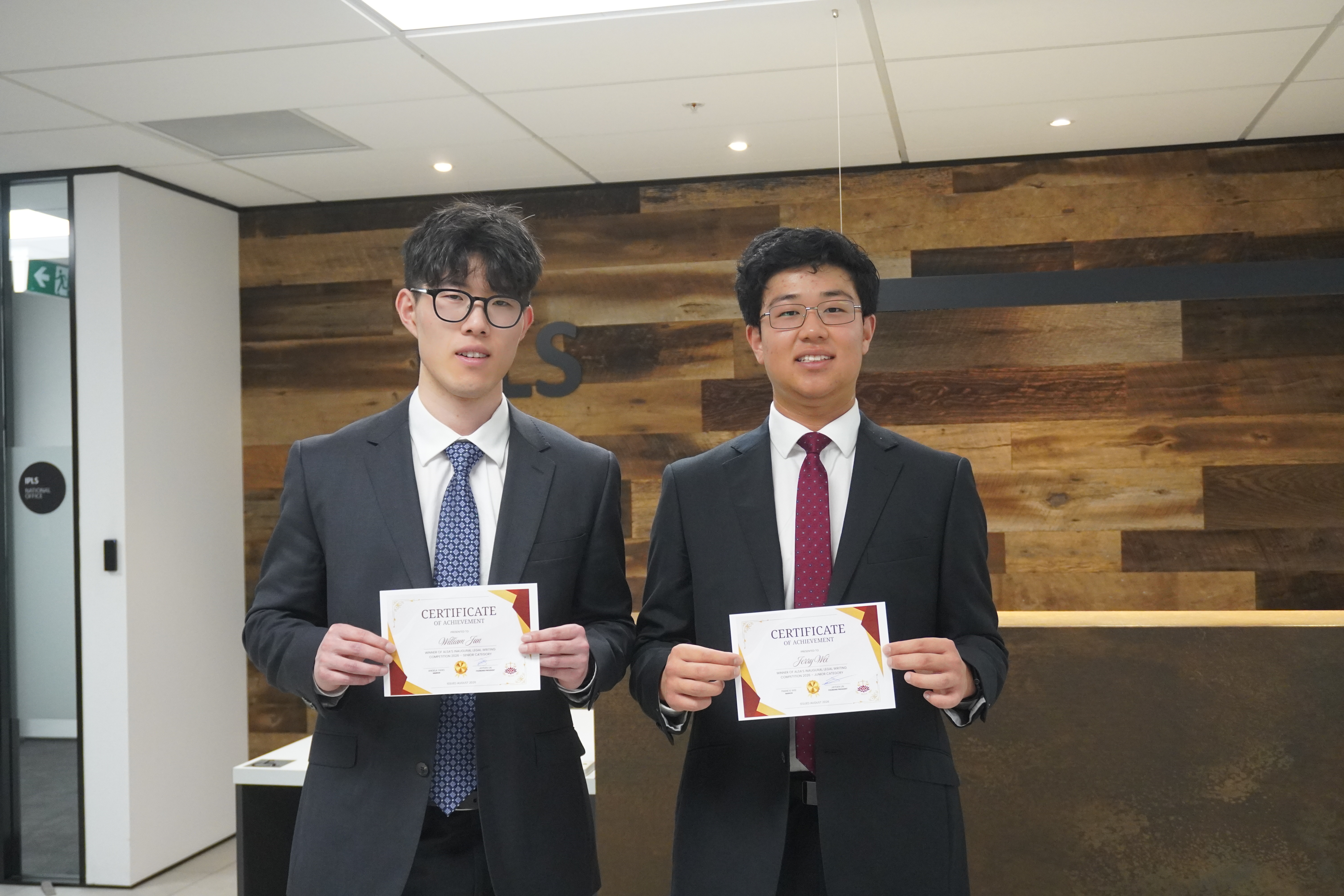 ALSA Legal Writing Competition winners William Jun and Jerry Wei with their certificates