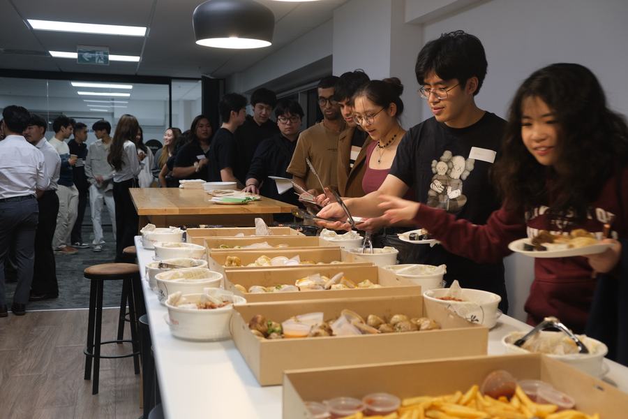 Members enjoying food at the Inaugural Launch Night